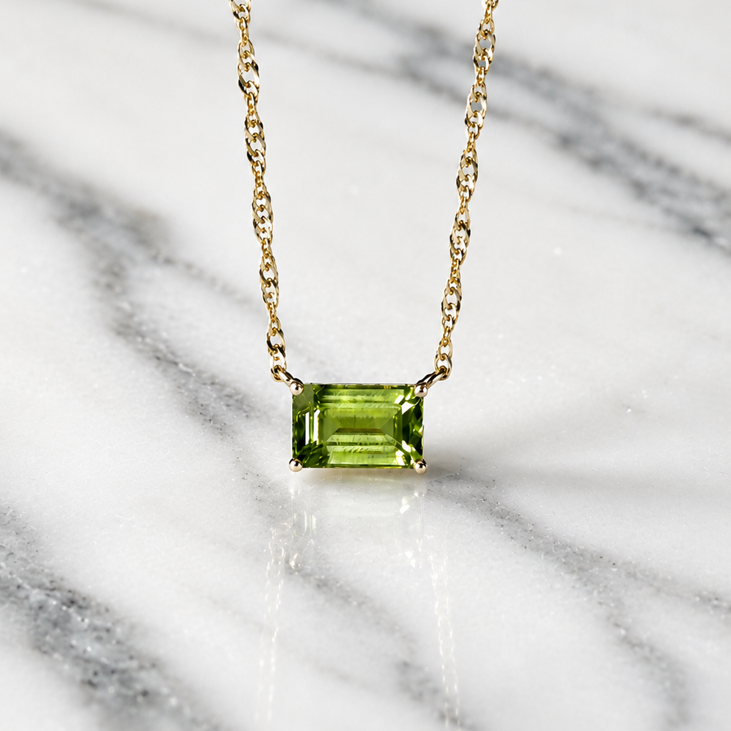 green peridot pendant on yellow gold chain